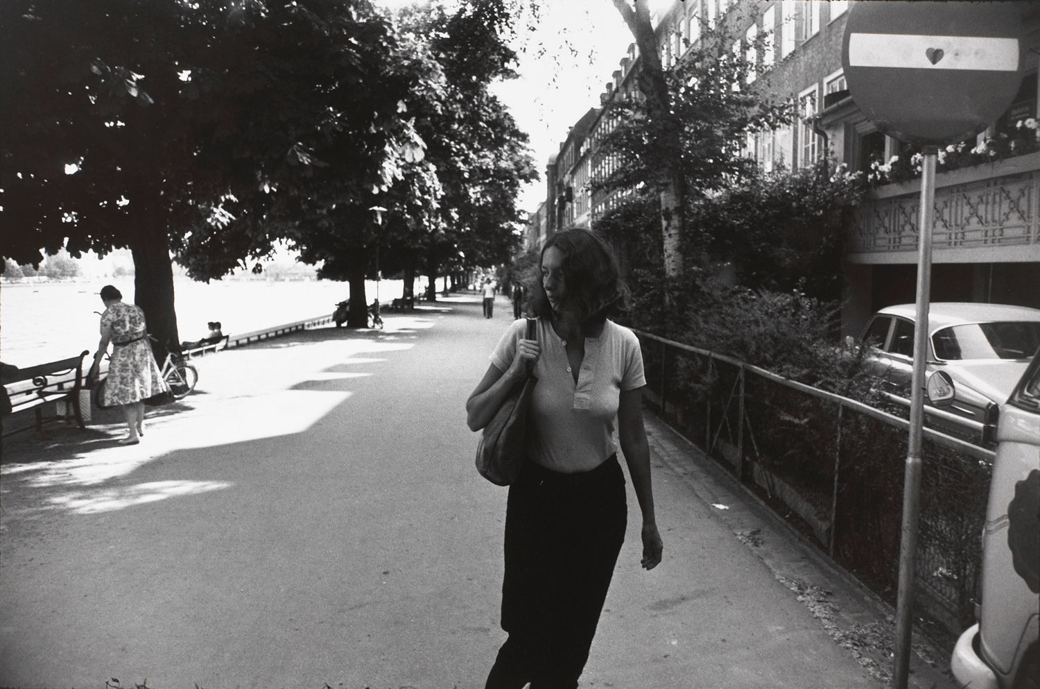Untitled (Woman walking along side a river)