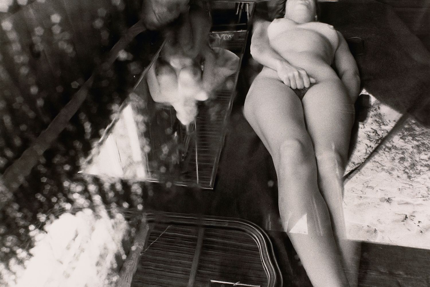 Untitled: Woman Laying Next to Another’s Reflection
