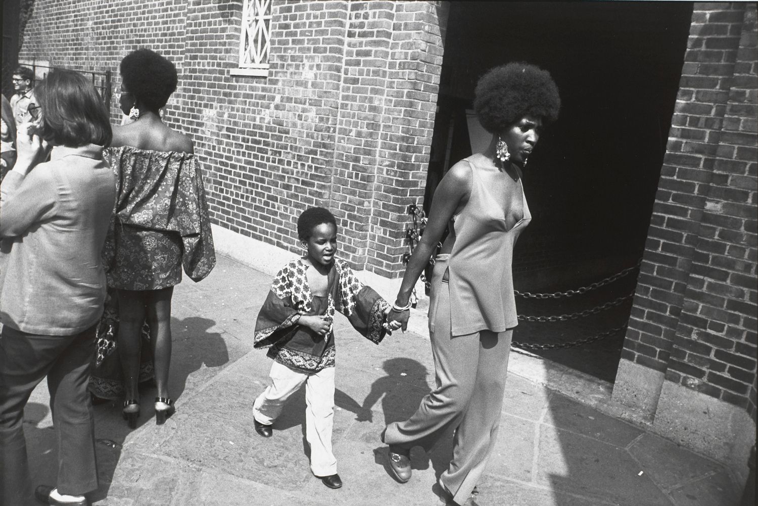 Untitled (Woman walking with a young boy)