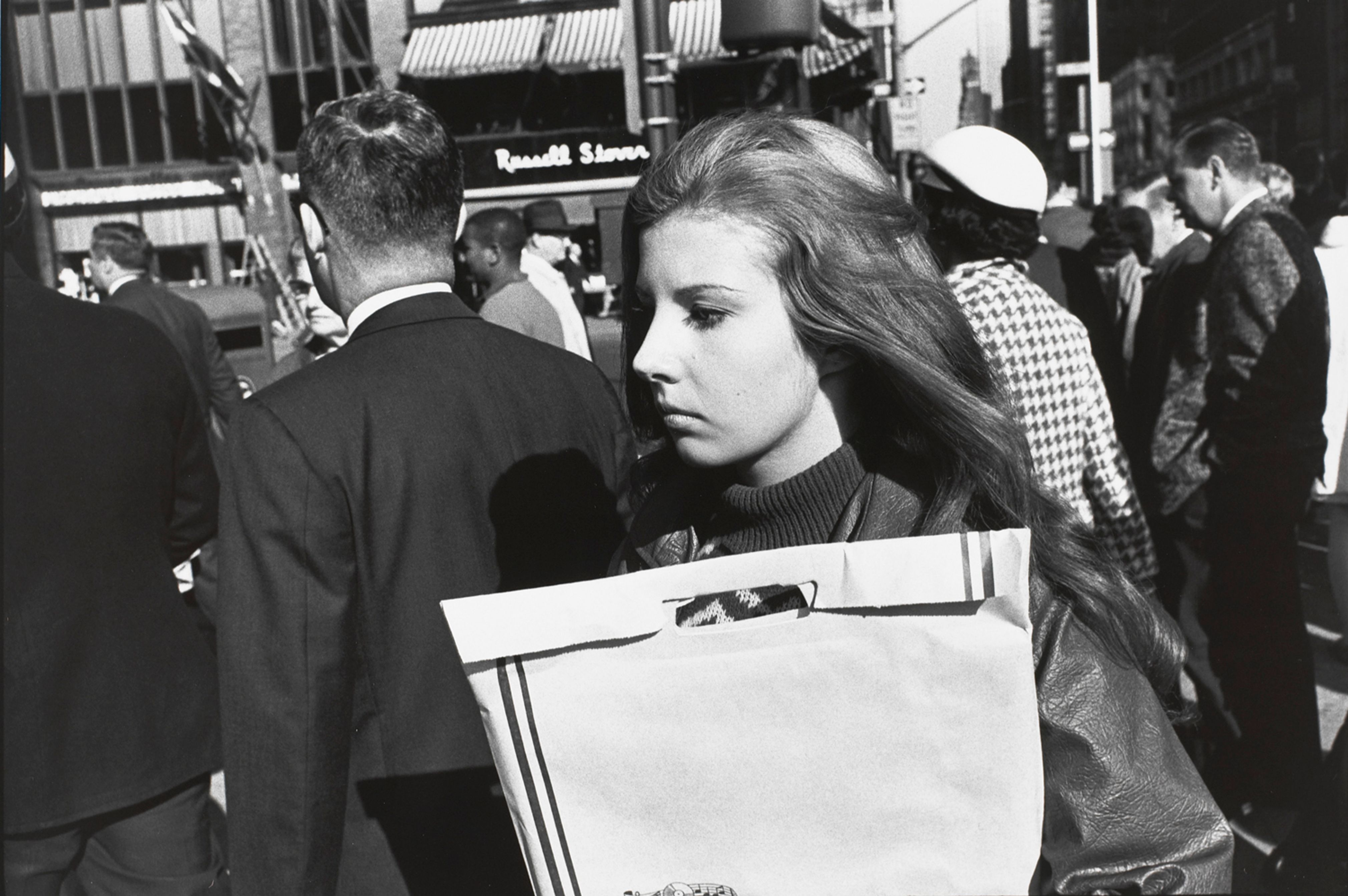 Untitled (Woman in profile walking down street)