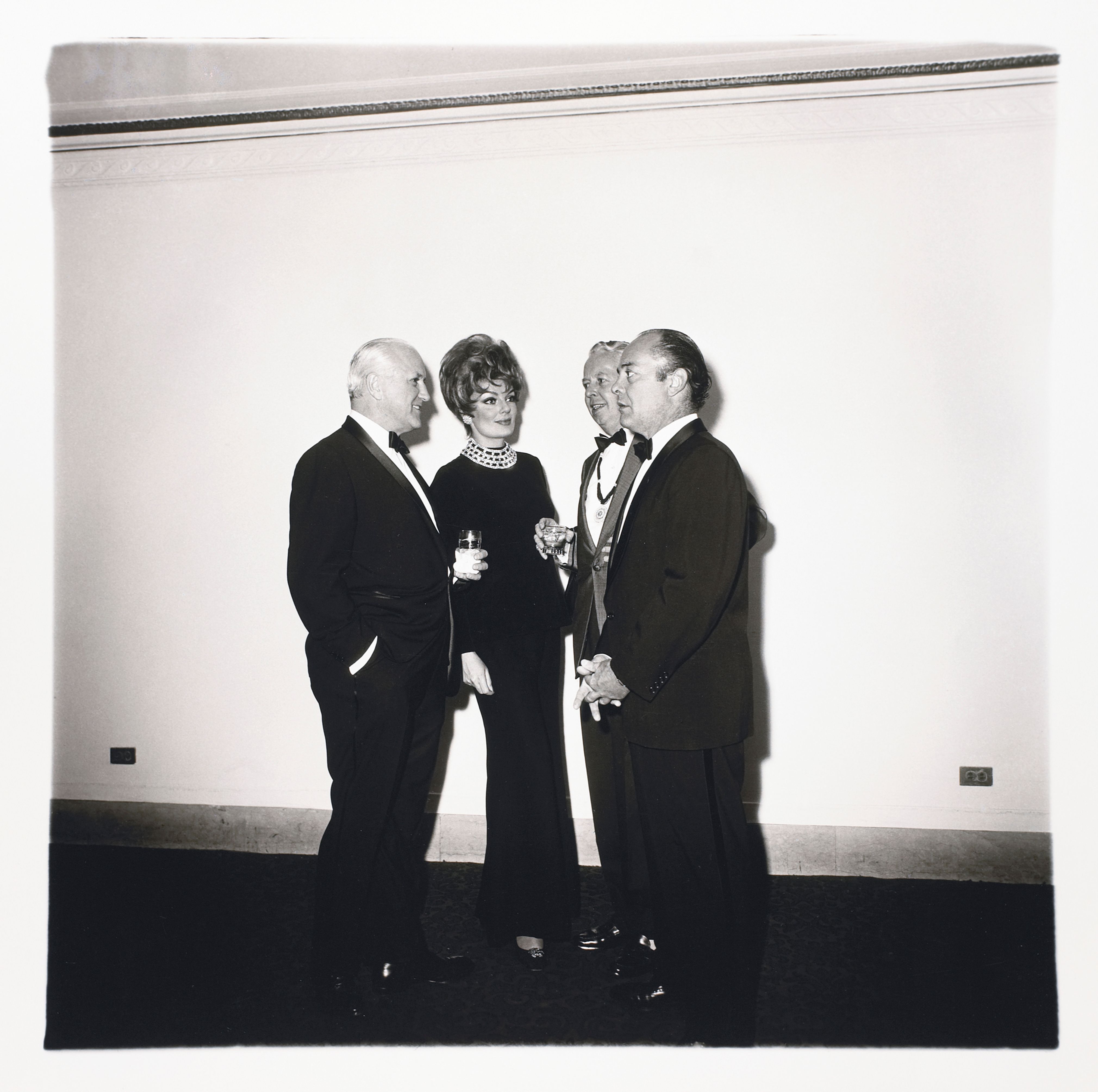 Four people at a gallery opening, N.Y.C.