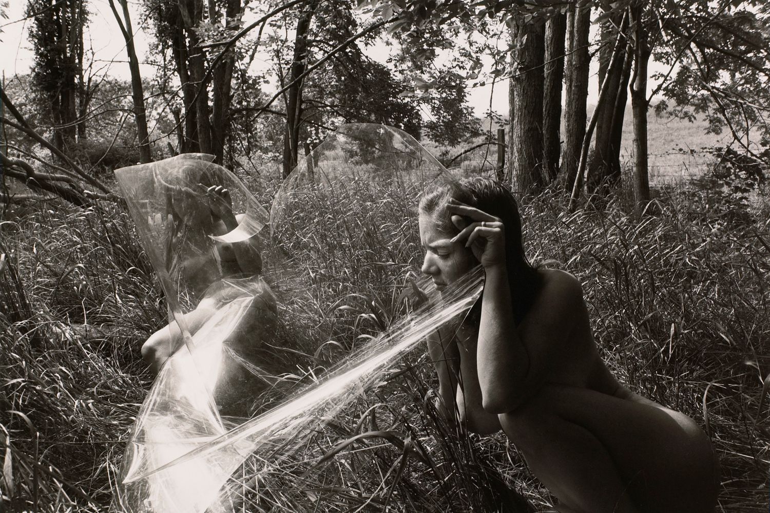 Untitled: Women Looking Through Plastic