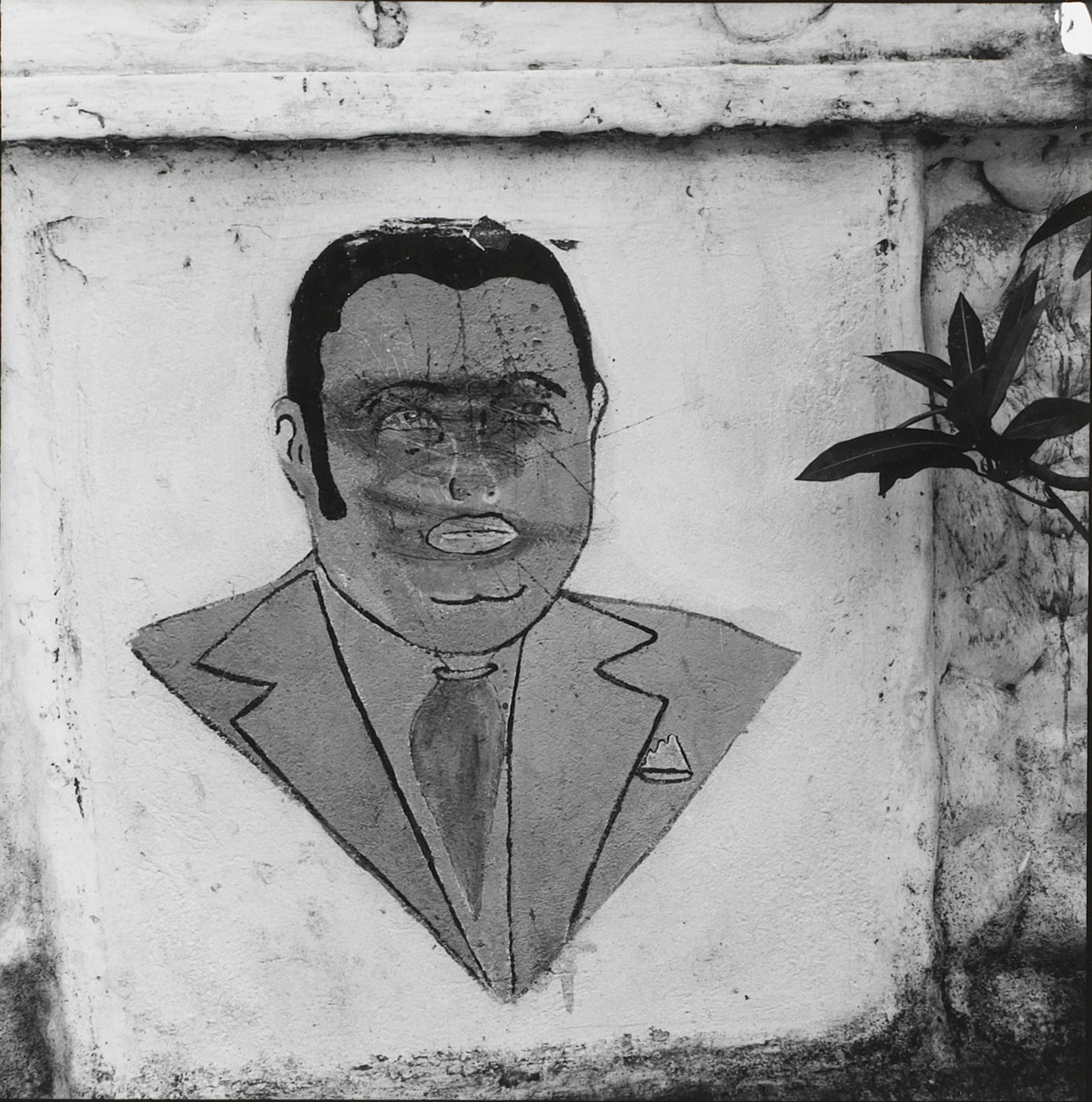Baby Doc. Defaced mural in Léogâne