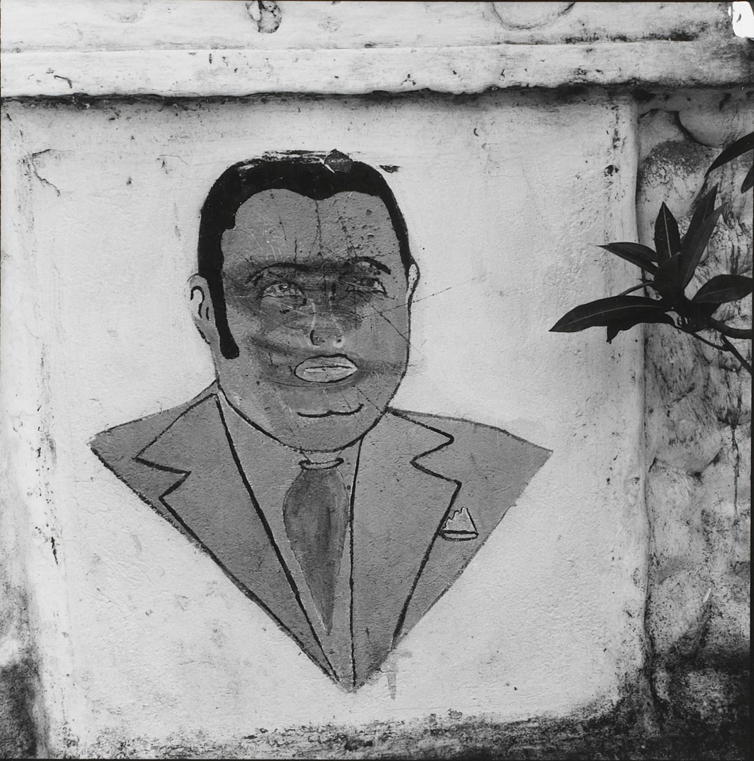 Baby Doc. Defaced mural in Léogâne