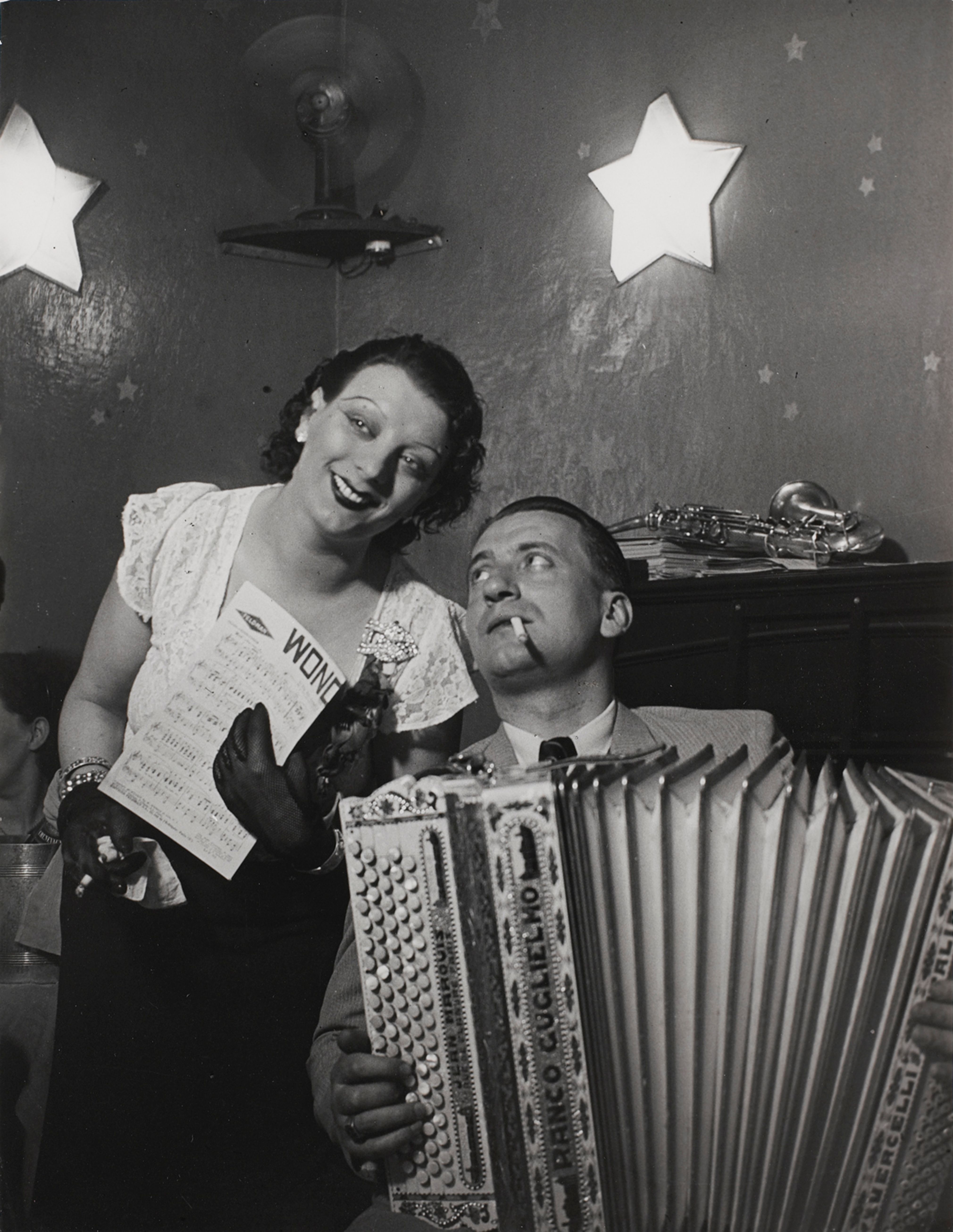 Kiki with her accordion player at the Cabaret des Fleurs, Rue de Montparnasse