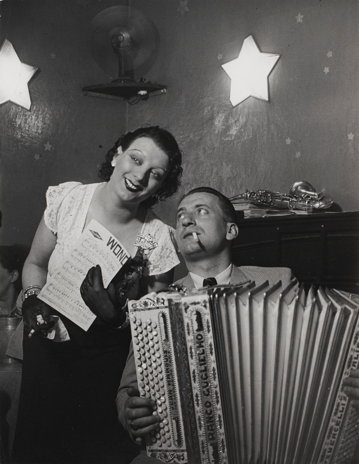 Kiki with her accordion player at the Cabaret des Fleurs, Rue de Montparnasse