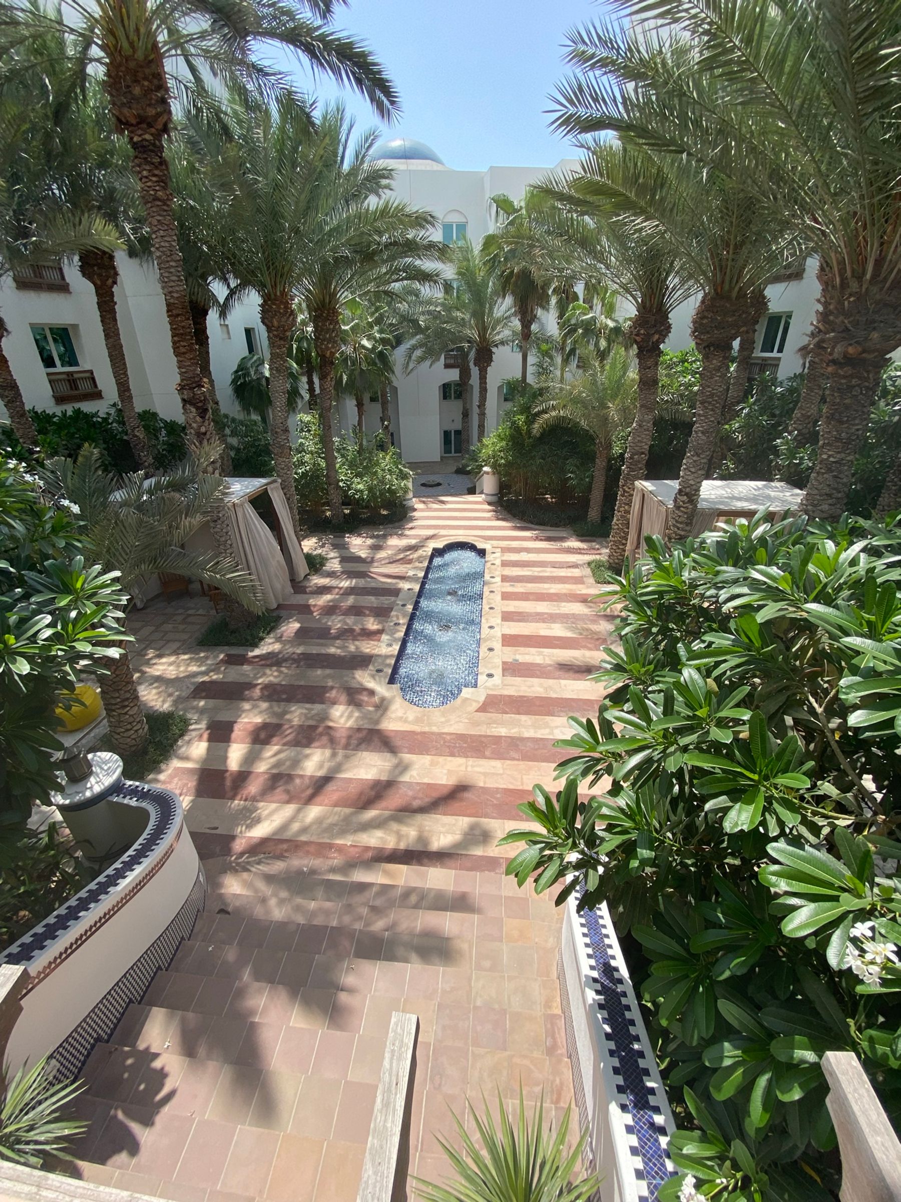 Palm-lined courtyard and fountain at Park Hyatt Dubai, photographed during my May 2021 stay