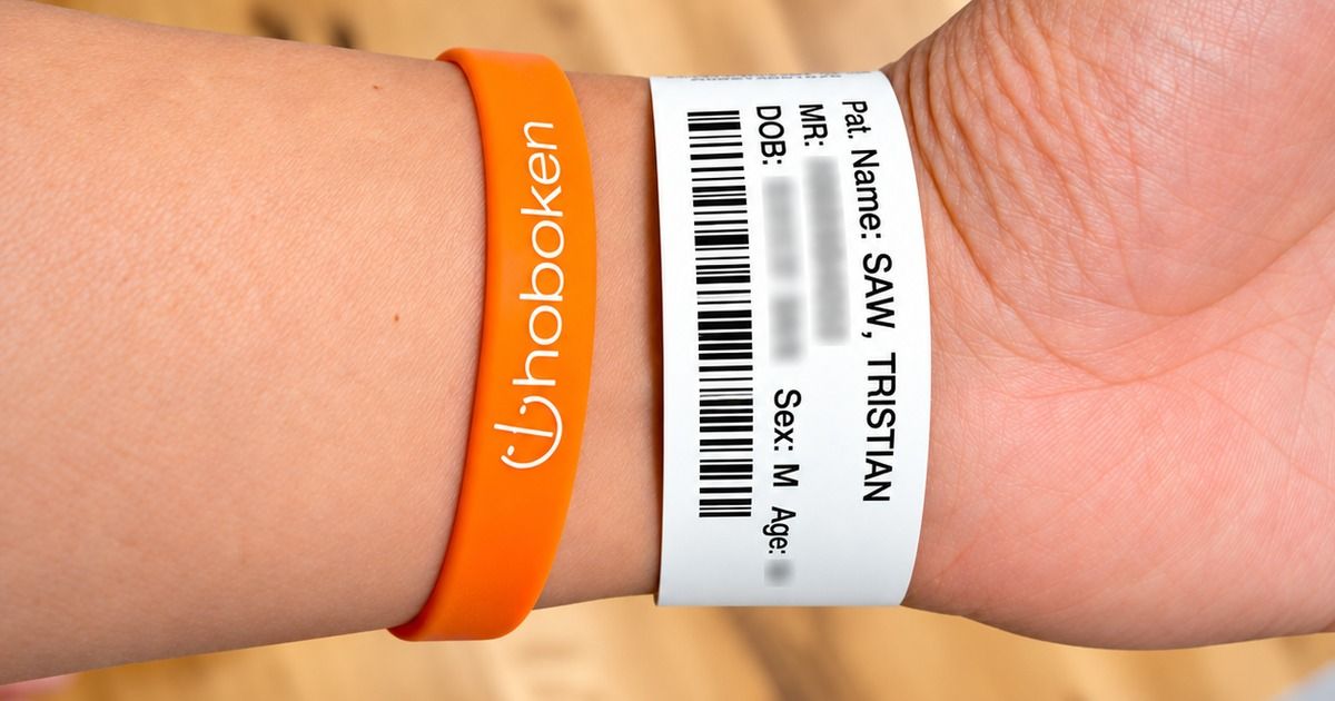 Hospital wristband and Hoboken Grace bracelet on wrist