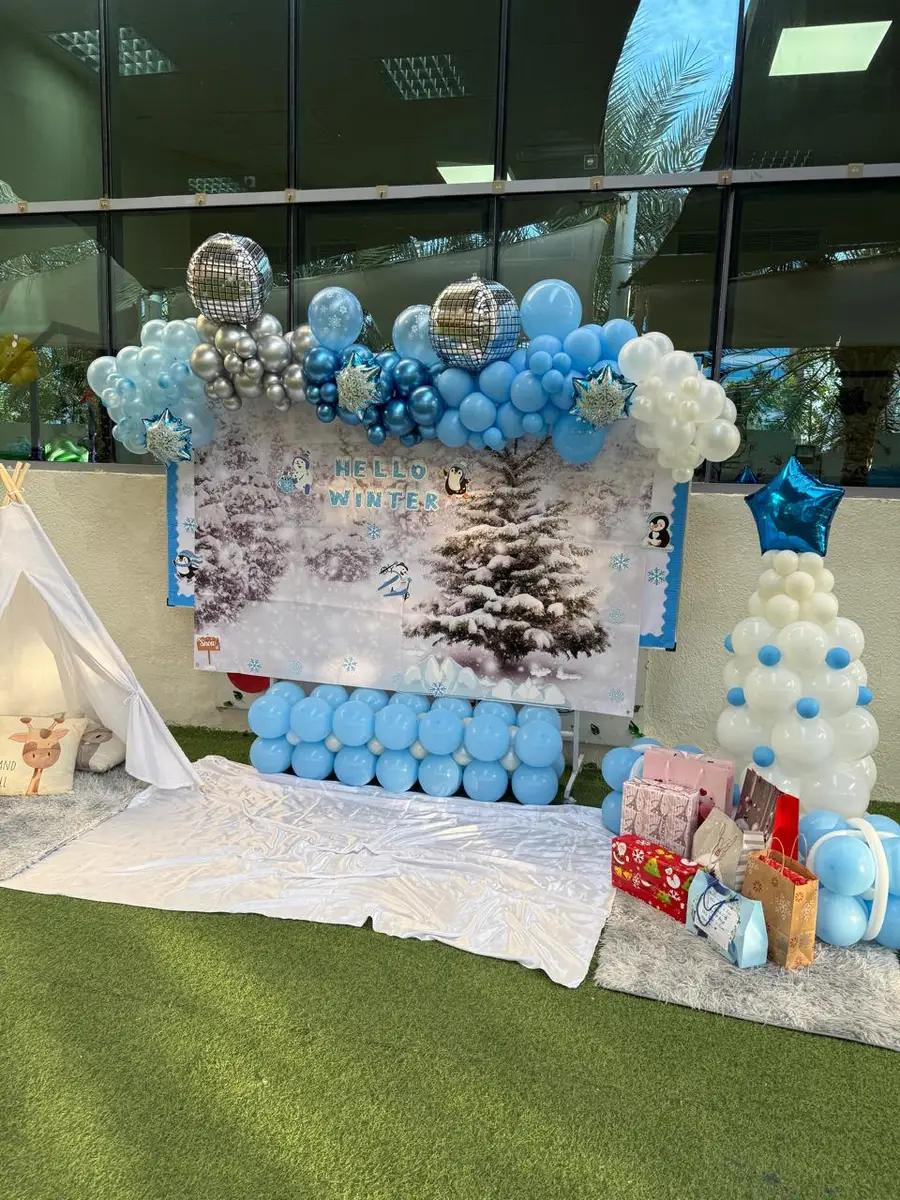 Hello Winter celebration corner with balloon arch and teepee