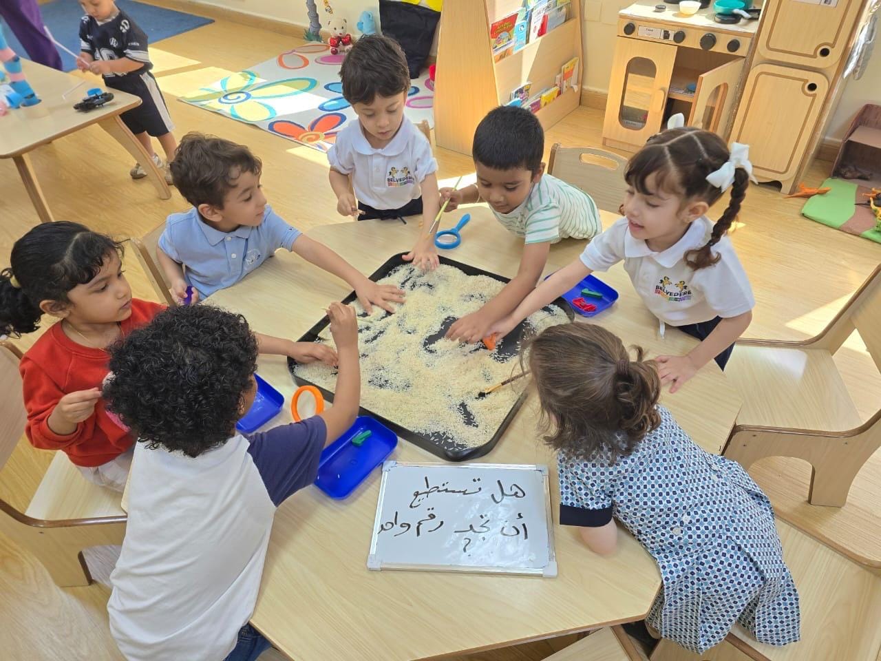 Children exploring a sensory discovery tray together