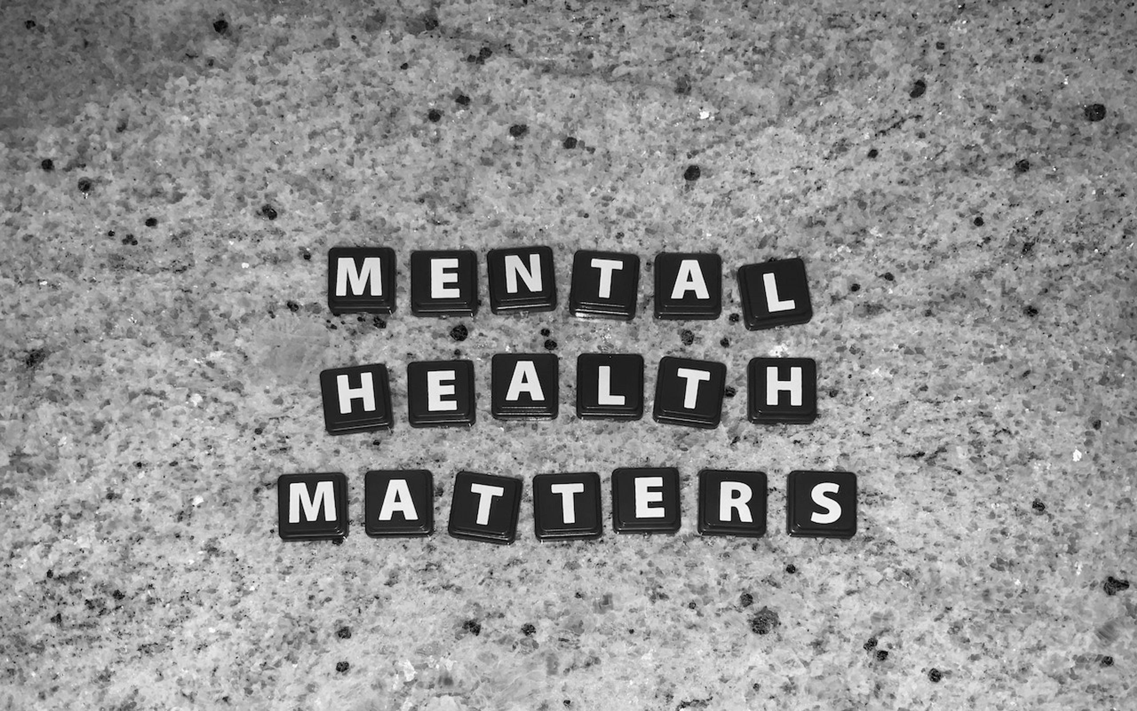 Black tile letters spelling out "mental health matters"