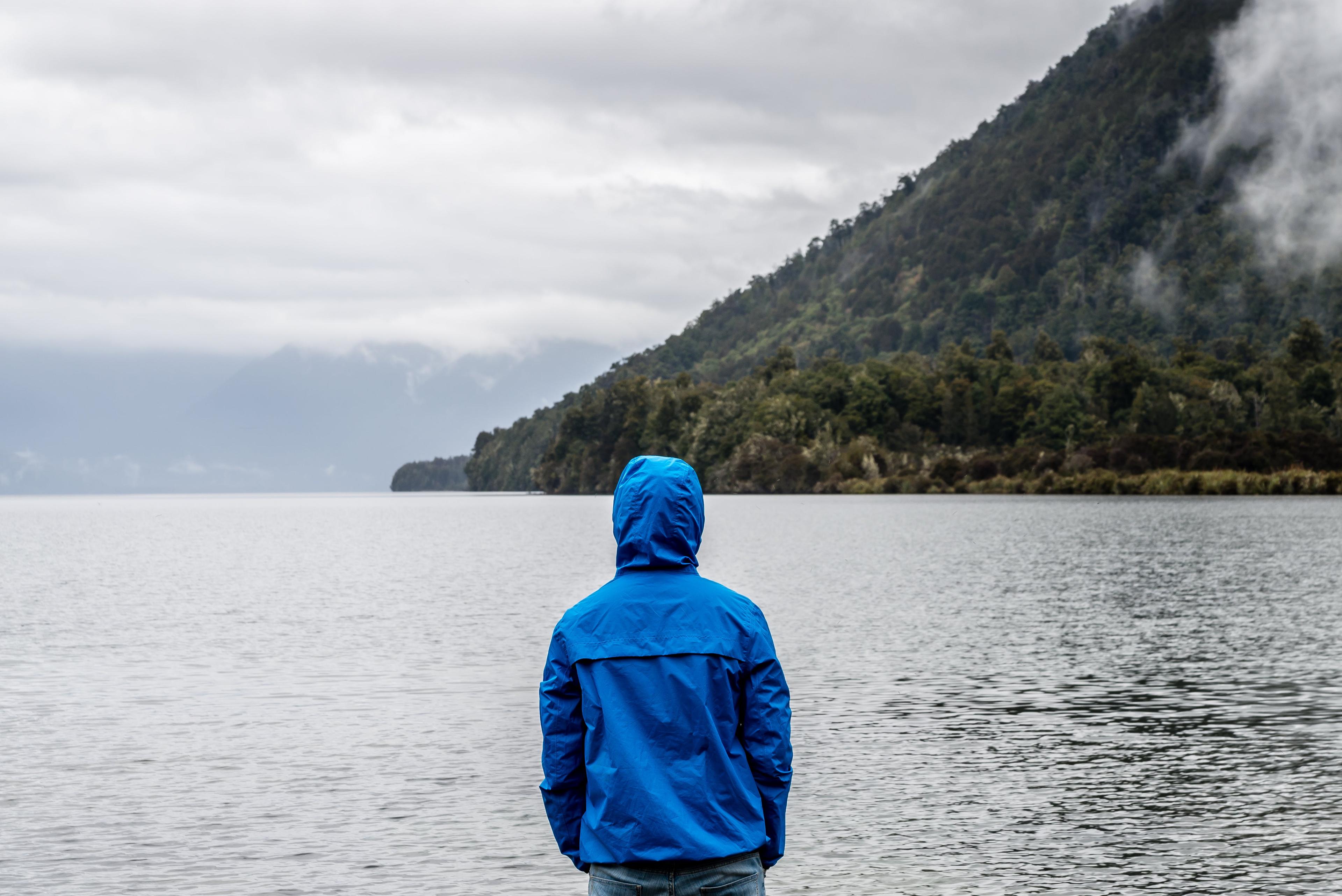 Person alone looking at lake