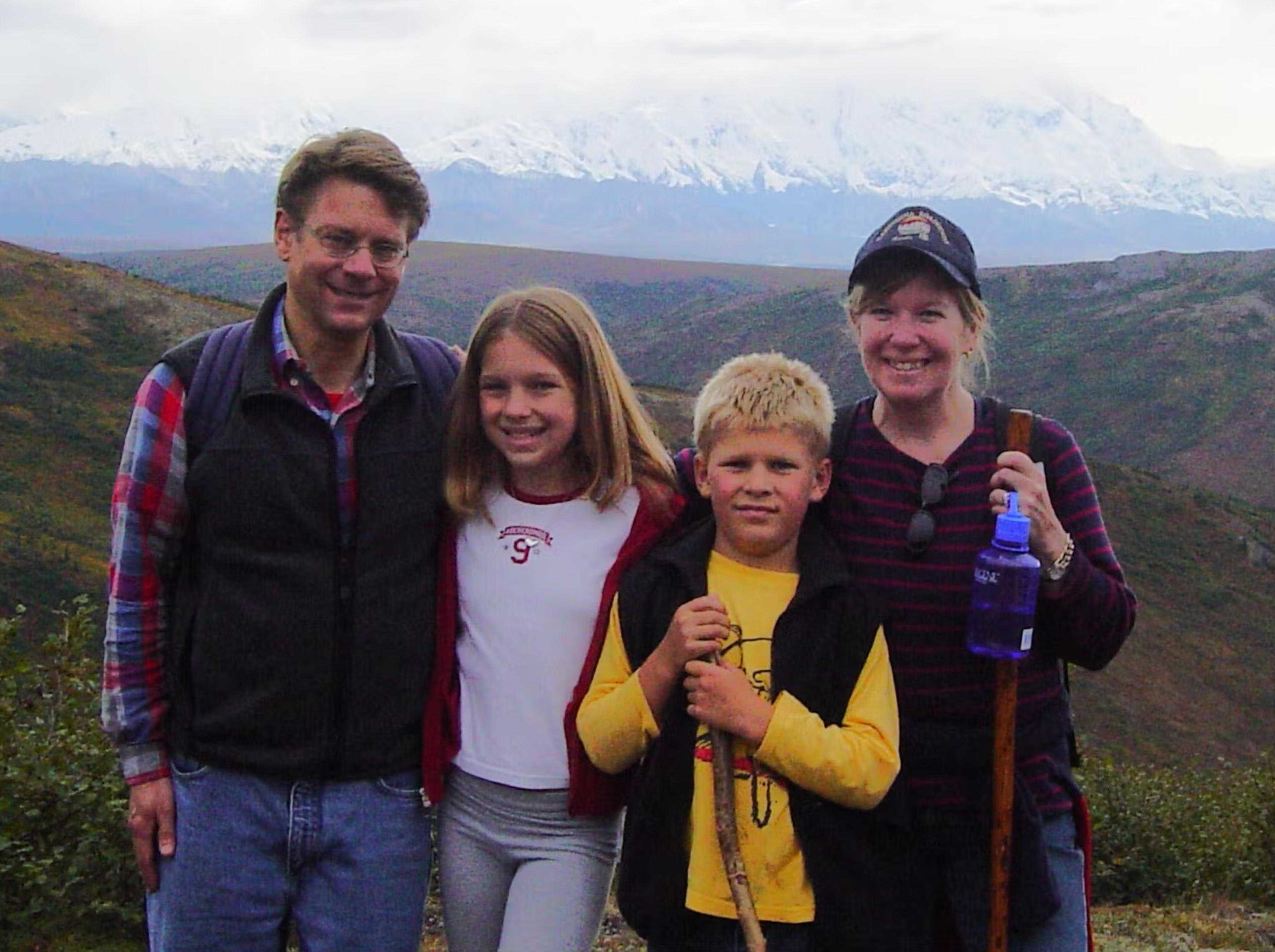 Equip founder Kristina Saffran as an adolescent, posing with her family while hiking with mountains in the background.