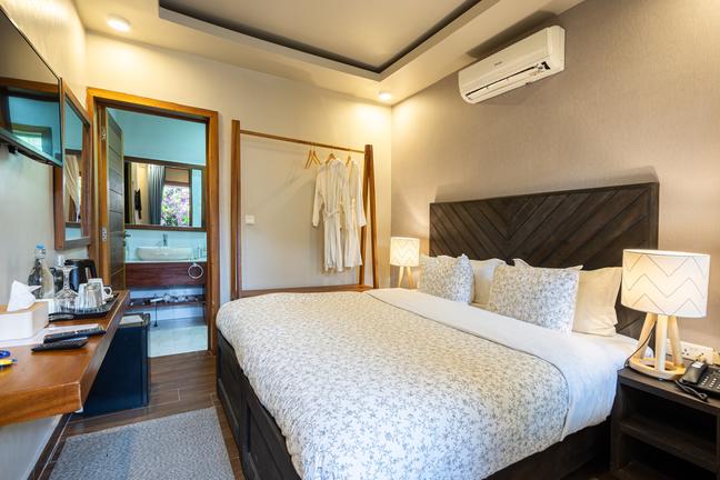 Hotel bedroom with large bed and en suite bathroom