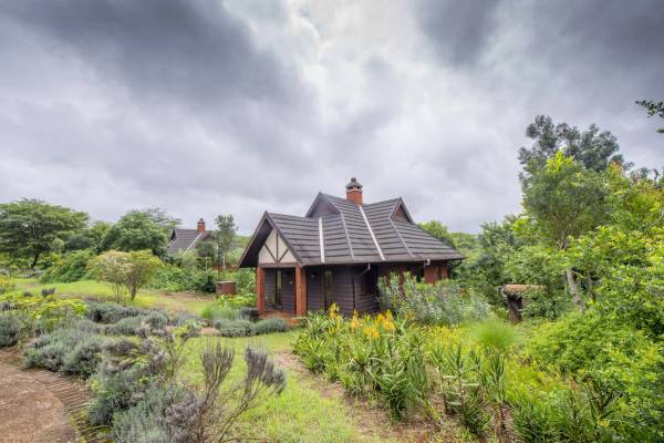 Villa building surrounded by green lush landscape