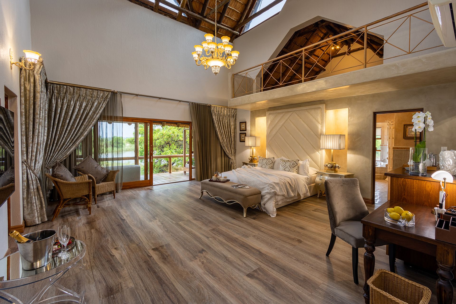 Kingfisher Villa large suite with triple volume ceiling and double bed in the middle of the room