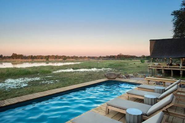 Sable Alley pool and loungers overlooking water