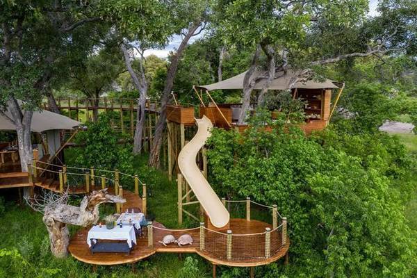 Tuludi treetop suites with slide leading from one to another