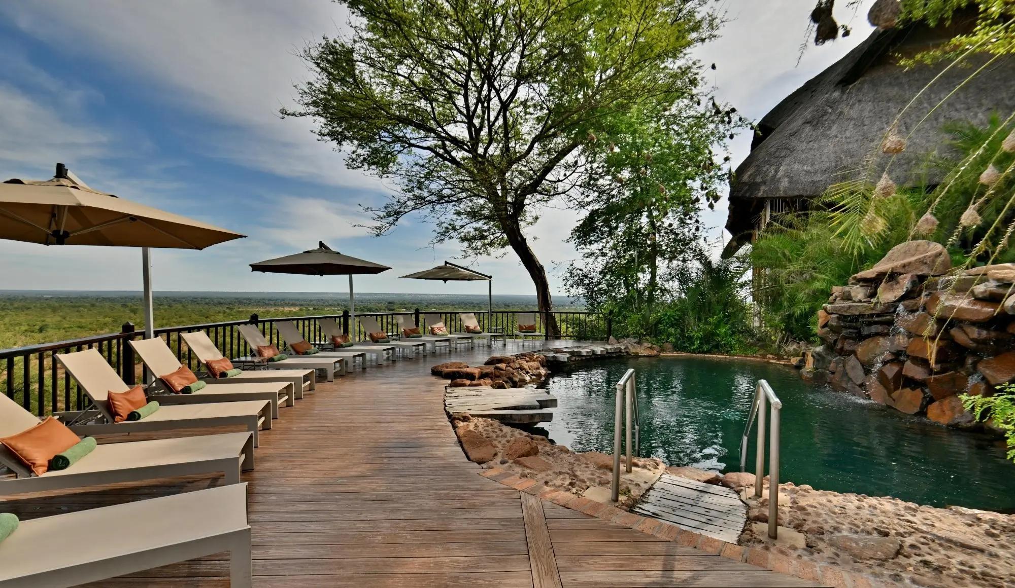 Victoria Falls safari lodge poolside with loungers