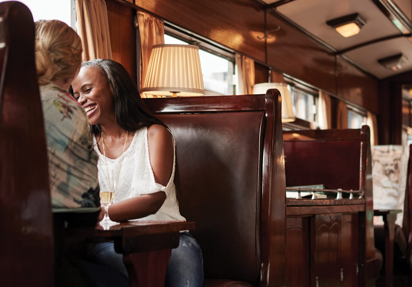 Two woman sitting in Rovos Rail dining carriage