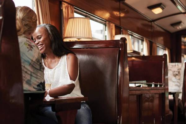 Two woman sitting in Rovos Rail dining carriage