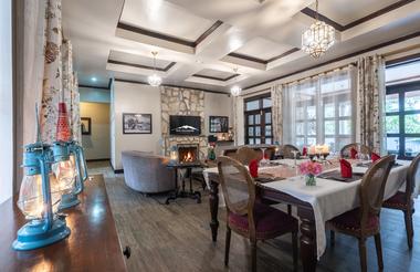 Hotel restaurant with set table and fireplace