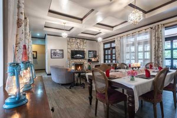 Hotel restaurant with set table and fireplace