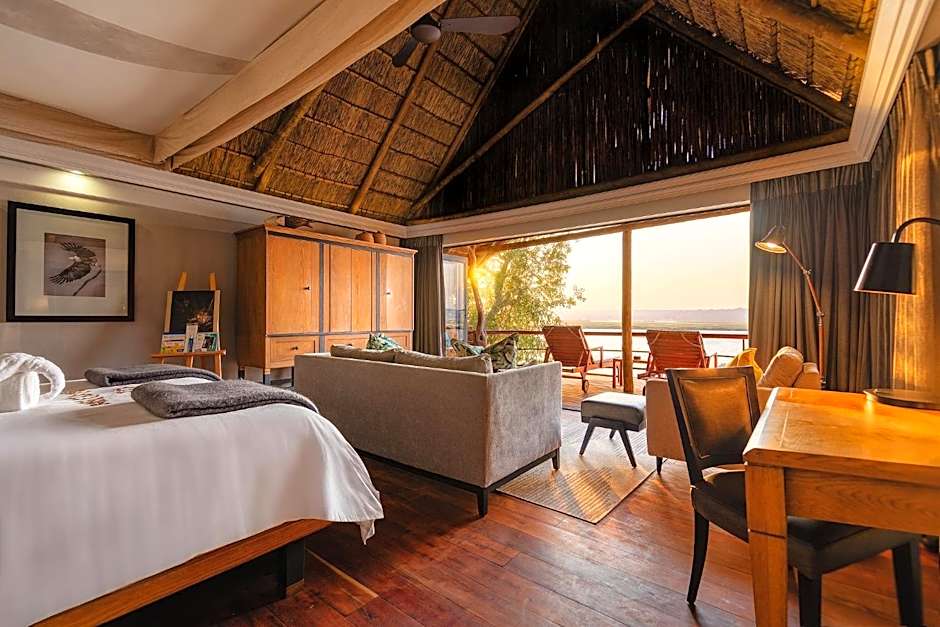 Chobe Water Villas suite with double bed and lounge area