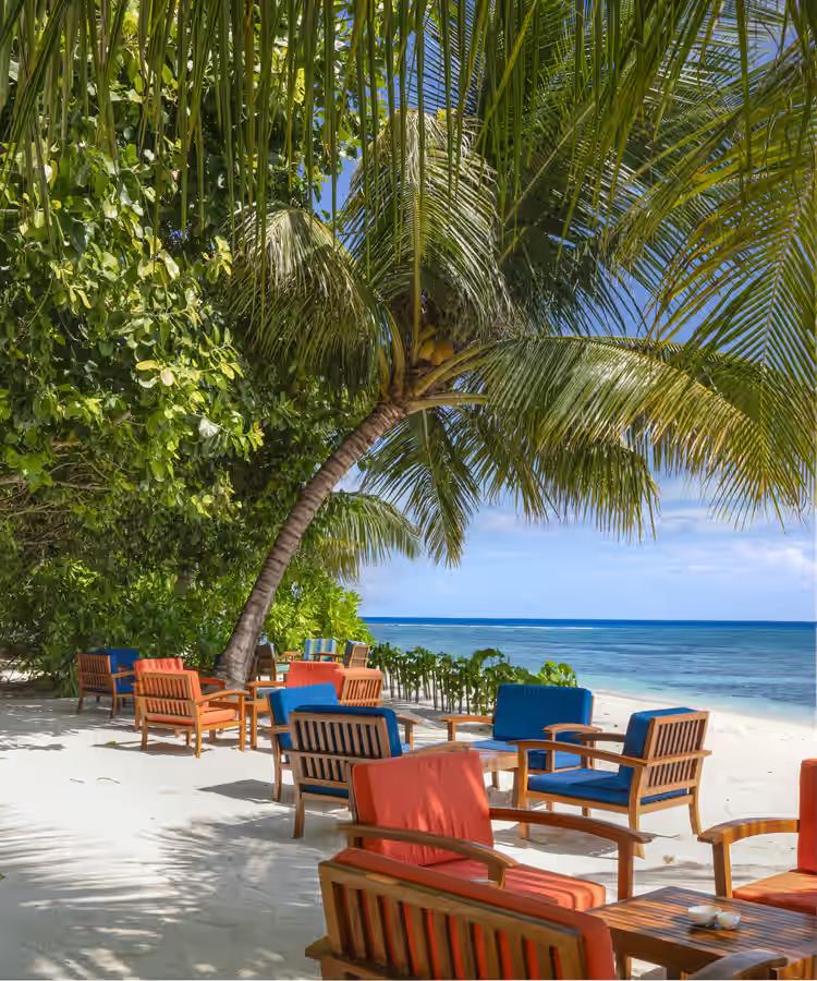 Adaaran Prestige Vadoo colourful loungers on beach