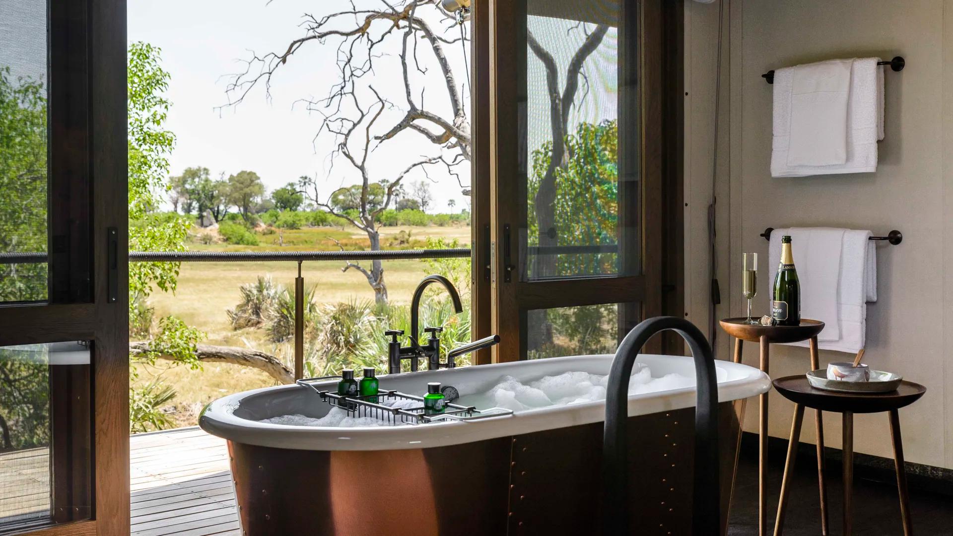 Xigera Lodge bubble bath overlooking wilderness
