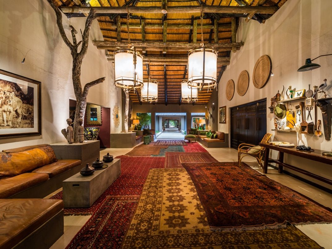 Sabi Sabi bush lodge hallway with Persian carpets and leather sofas