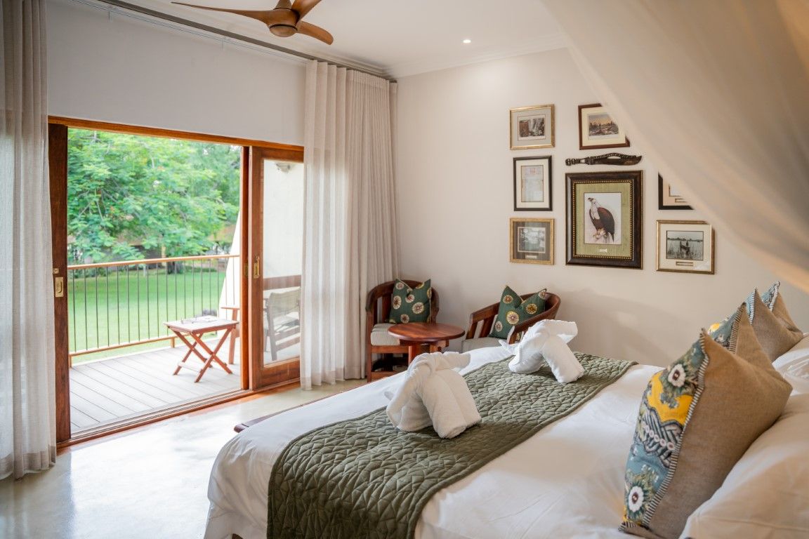 Chobe Safari Lodge suite with double bed overlooking private terrace