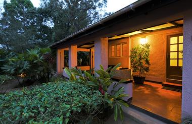 Front porch lit up at night of Boma Hotel Entebbe