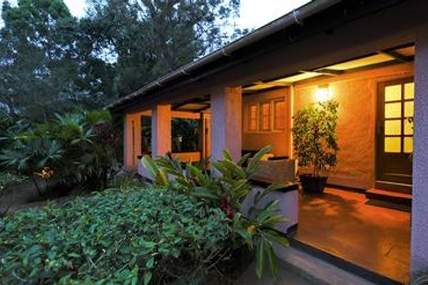 Front porch lit up at night of Boma Hotel Entebbe