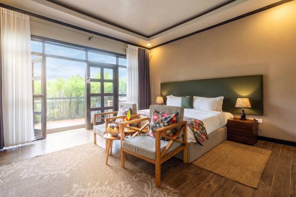 Five Volcanoes Boutique Hotel deluxe room with double bed and terrace