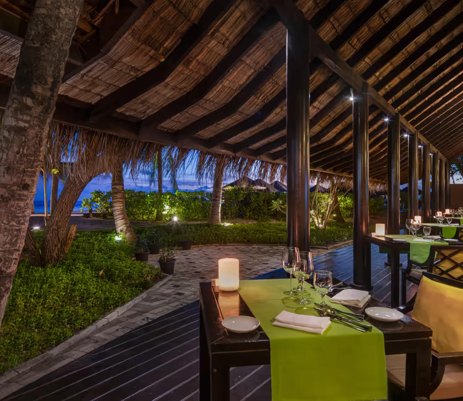Wooden chalet with candle lit dining tables