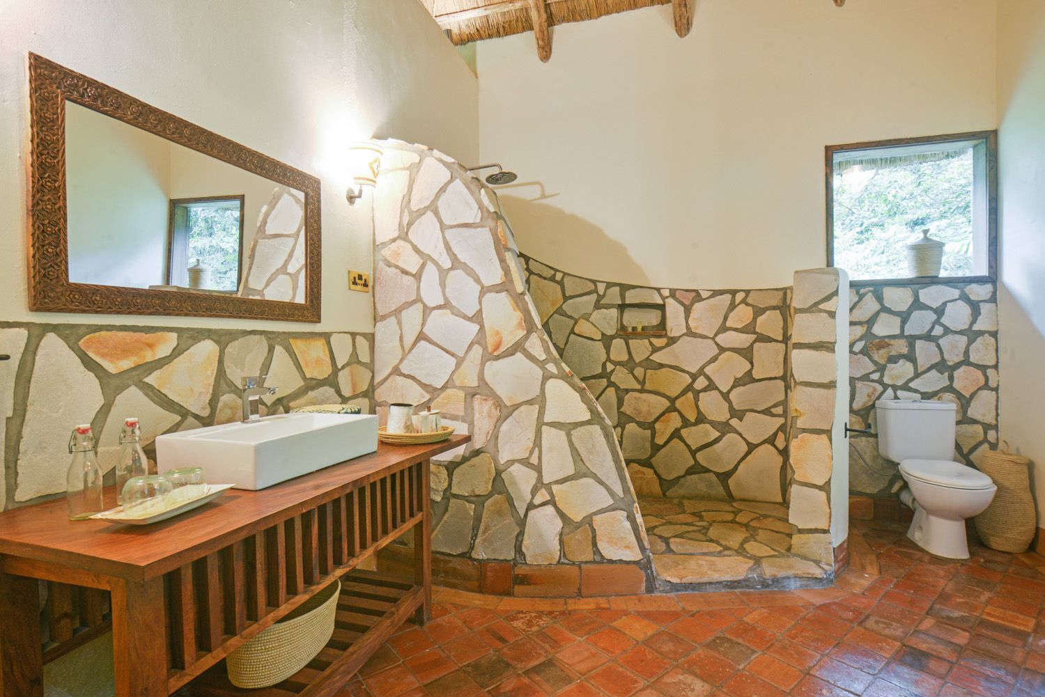 Bathroom with stone wall shower