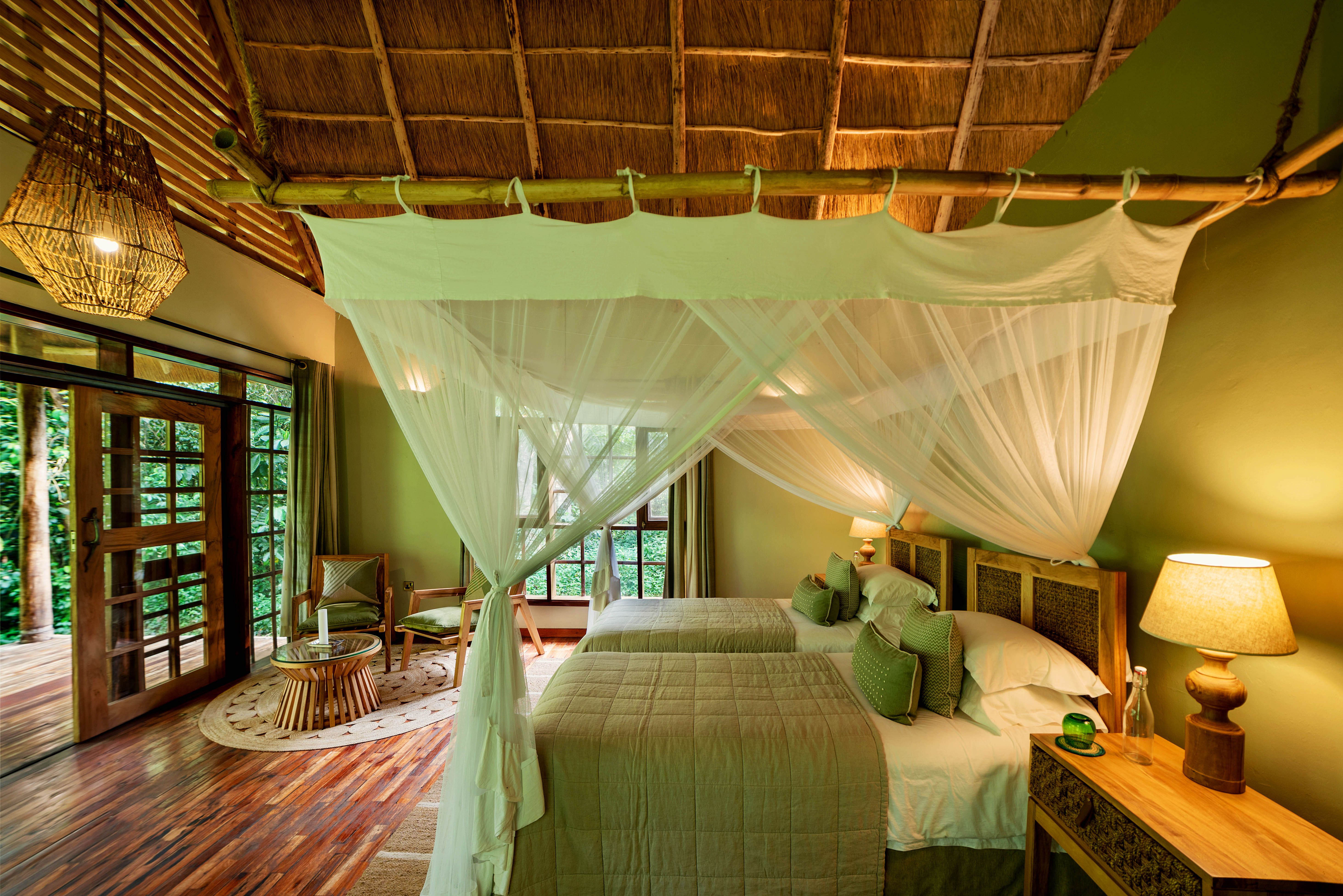 Two single beds with mosquito net curtains