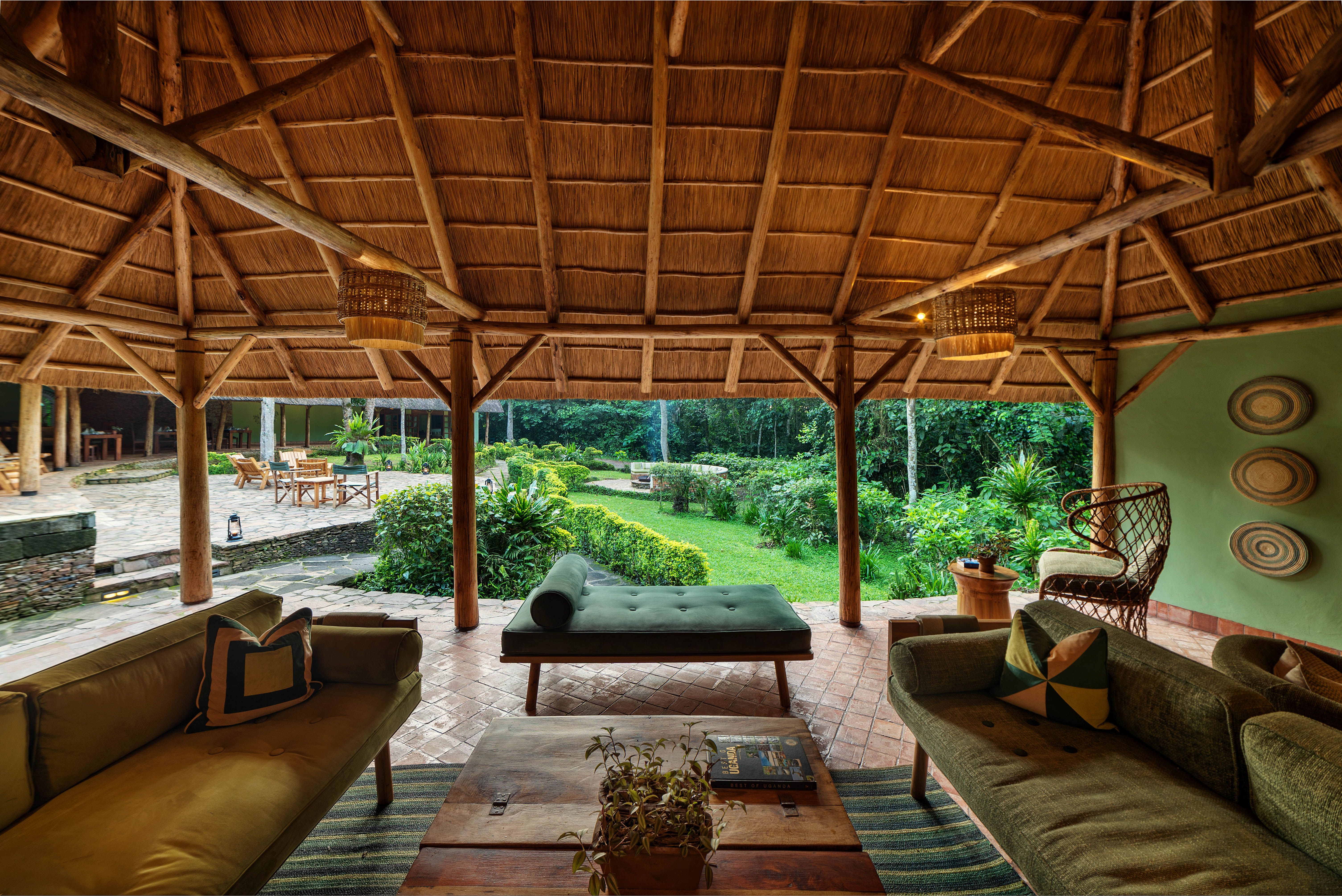 Lounge with sofas and coffee table overlooking green garden