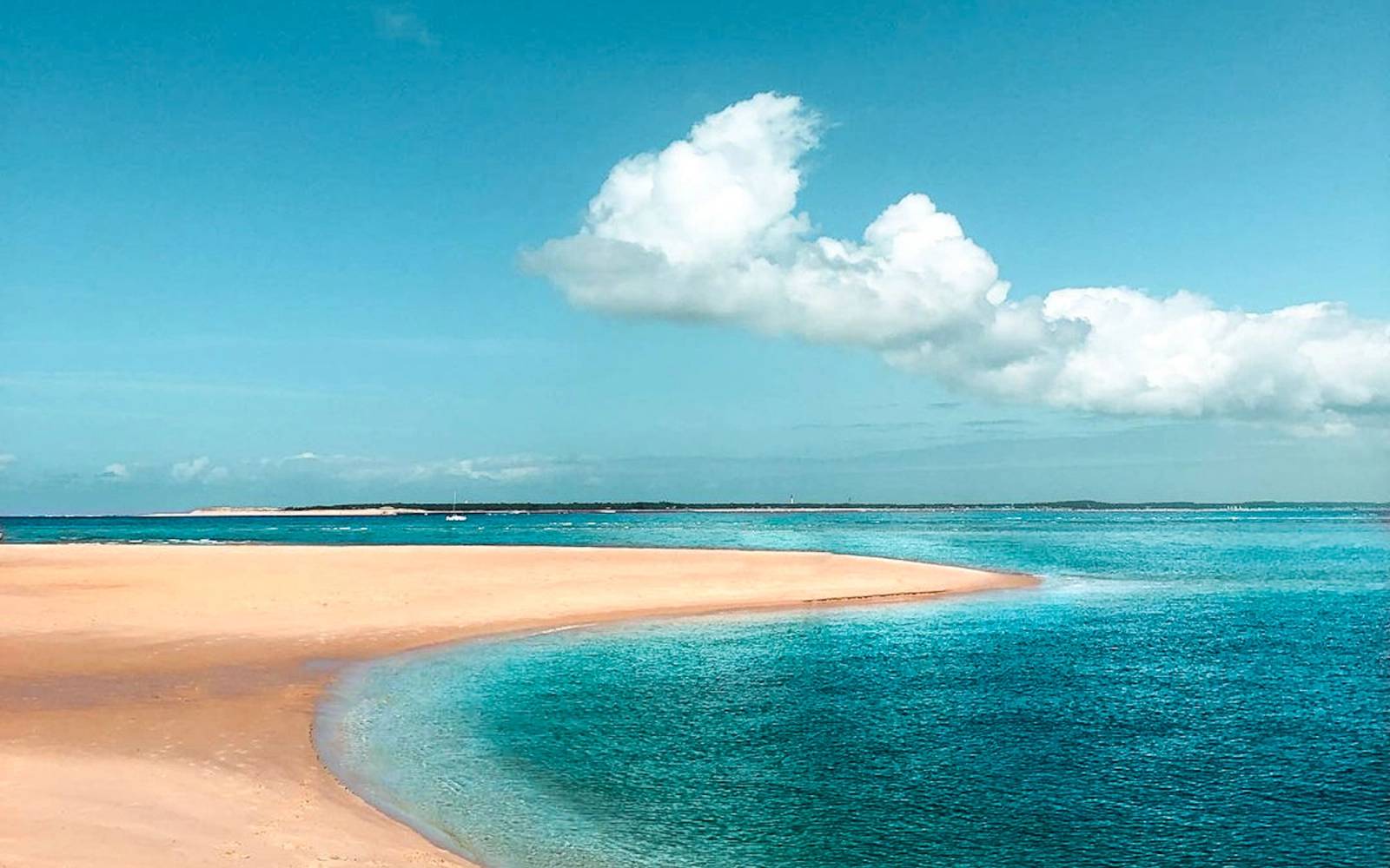 Calm beach with calm bright blue ocean