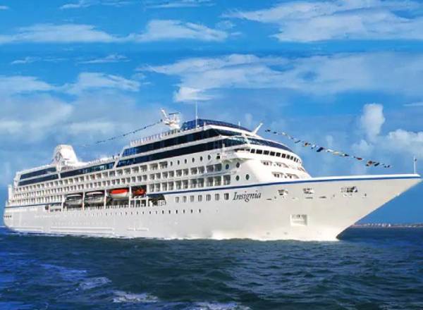 The Oceania Insignia gliding across the water in a vast ocean