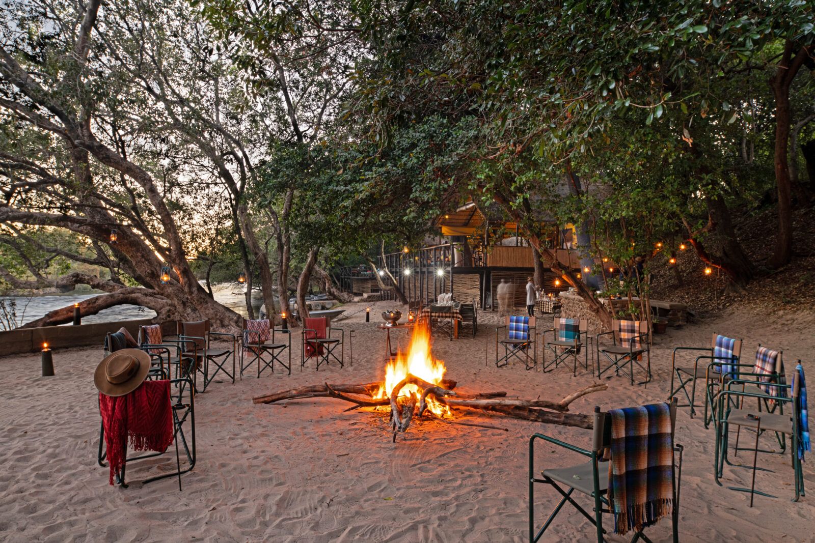 Ichingo Chobe River Lodge Boma and braai area with fire pit surrounded by camping chairs