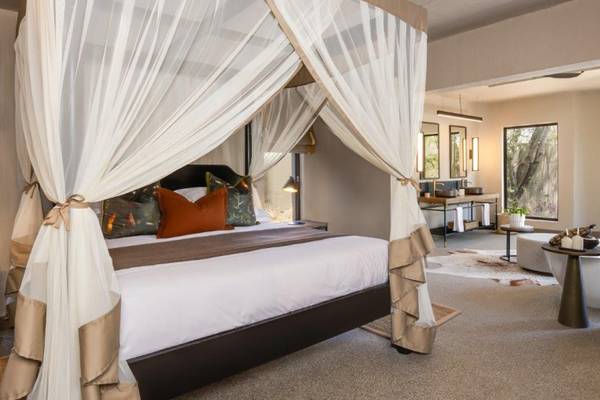 Sabi Sabi bedroom with kings sized four poster bed with mosquito net