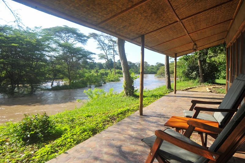 Two deck chairs in veranda overlooking river