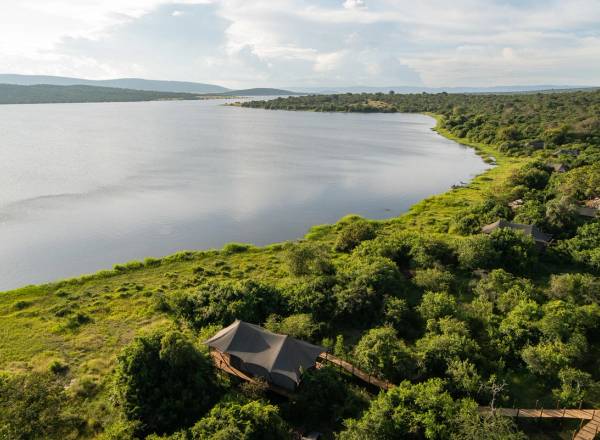 Aerial view of waters of Lake Rwanyakazinga and the Mutumba Mountains in the background and Wilderness Magashi Lodge in the foreground