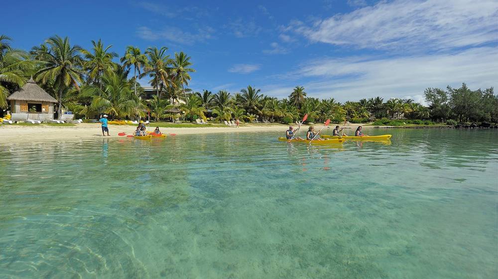 Guests kayaking in the turquoise waters off Shandrani Beachcomber Resort.