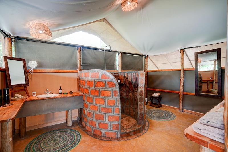Bathroom with brick cylindrical shower