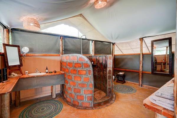 Bathroom with brick cylindrical shower