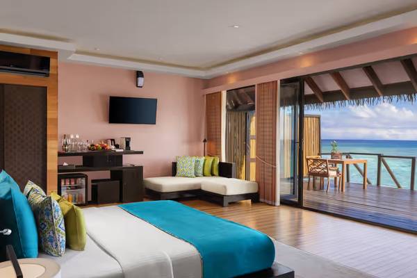 Luxury suite with double bed overlooking water