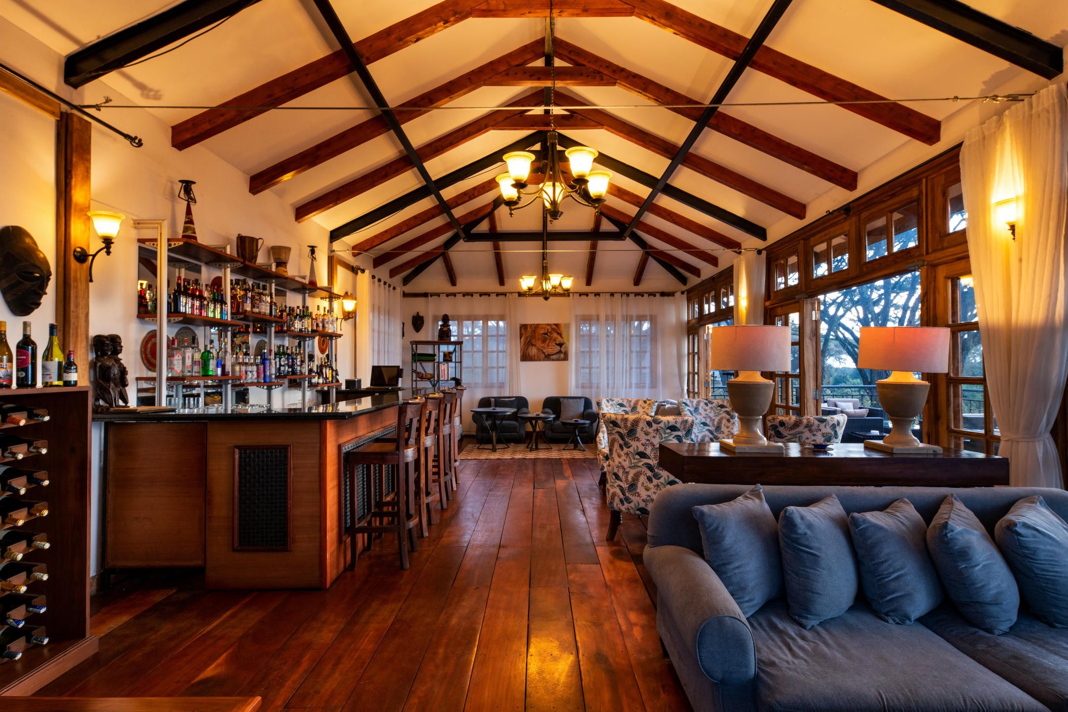 Ngorongoro Lion's Paw bar and lounge with wooden floors and beams